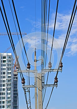 Electricity post and cable line with blue sky