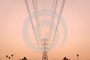 Close-up high-voltage transmission tower electric pole and wiring cable with sky background