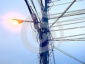 Tangled wires on electricity post