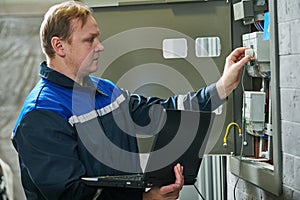 Electricity power control and metering. Worker collects data