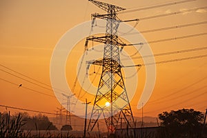 Electricity power pylons during sunset