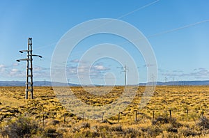 Electricity power tower line pylons at the sunrise.