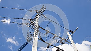 Electricity power tower and transmission lines against with blue sky