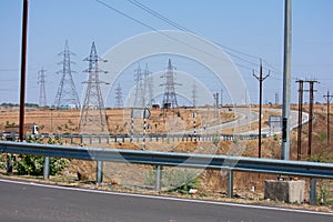 Electricity Power Transmission Lines and High Voltage Electricity Transmission Towers at Highway