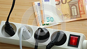 Electricity price, Power strip and deductible Euro currency, Concept of energy increase for companies and households in the Europe