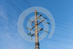 Electricity pylon against blue sky