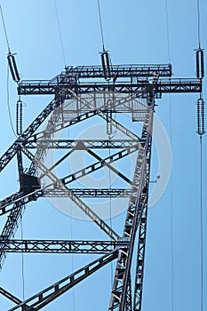 Electricity pylon against blue sky