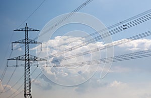 Electricity pylon against a blue sky