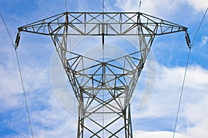 Electricity pylon against a sky background - power tower and transmission lines