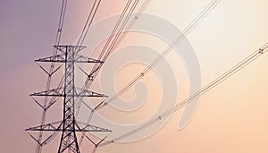 Electricity pylon against the violet and orange background