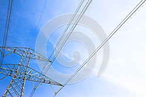 Electricity pylon on blue background - power tower and transmis