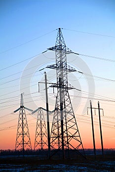 Electricity Pylon -China`s standard overhead power line transmission tower of the sunset.