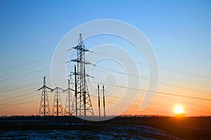 Electricity Pylon -China`s standard overhead power line transmission tower of the sunset.