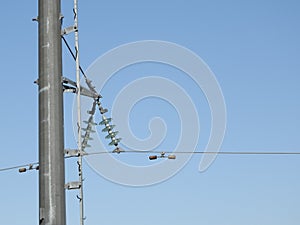 Electricity pylon, electric transmission tower, against the blue sky. Energy tower