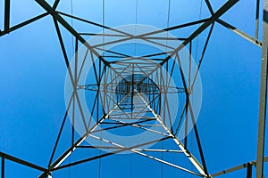 Electricity pylon for extensive free power transmission of high voltage in front of blue sky