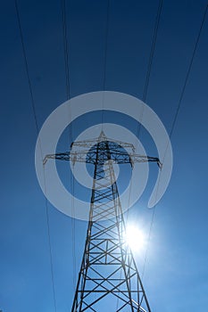 Electricity pylon for extensive free power transmission of high voltage in front of blue sky