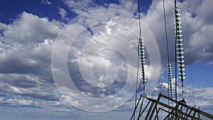 Electricity pylon high voltage power line on the background of the cloudy sky time lapse