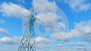 Electricity pylon and high voltage power line at sunny day. Transmission tower. Time lapse.