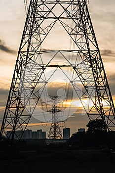Electricity pylon known as overhead line pylon. high-voltage power lines at sunset, high voltage electric transmission tower