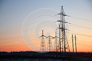 Electricity Pylon -China`s standard overhead power line transmission tower of the sunset.