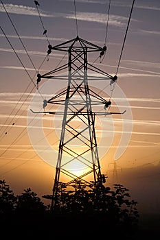 Electricity pylon at sunrise