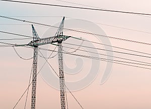 Electricity pylon transmission towers and electrical wires photo