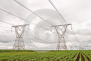 Electricity pylons against a stormy sky