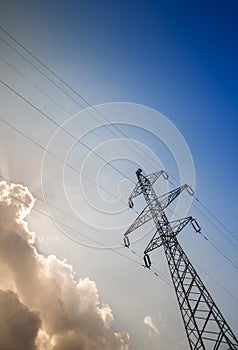 Electricity pylons with blue sky background