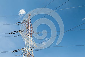 Electricity pylons with blue sky background
