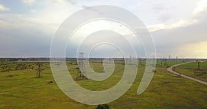 Electricity pylons in the countryside near a green field