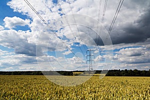 Electricity pylons going across the English countryside