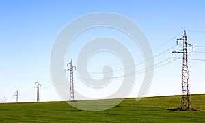 Electricity pylons line photo