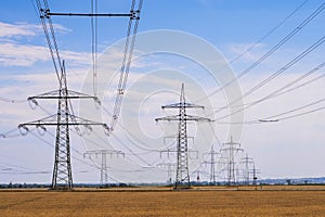 Electricity pylons line up one after the other