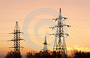 Electricity pylons and lines at dusk