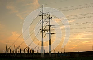 Electricity pylons with orange background photo