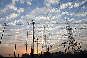 Electricity pylons and power lines, at sunset