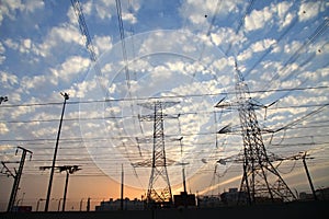 Electricity pylons and power lines, at sunset