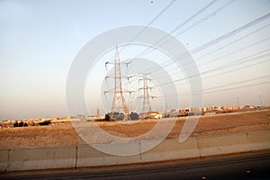 Electricity pylons and power lines, at sunset