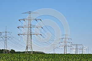 Electricity pylons and power lines with wind turbines