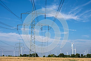 Electricity pylons, power lines and wind turbines