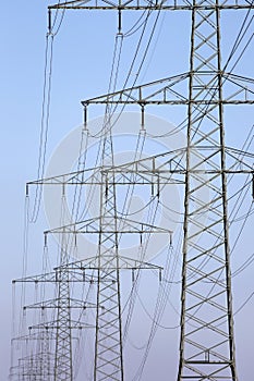 Electricity pylons in a row