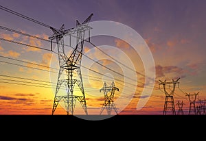 Electricity pylons at sunset photo