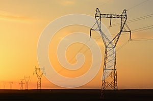 Electricity pylons at sunset