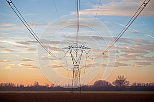 Electricity pylons at sunset