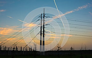 Electricity pylons during sunset