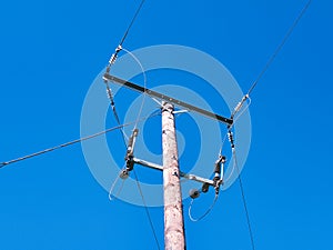 An electricity supply pylon delivering power through the UK national grid showing power cables, isolators and other equipment.