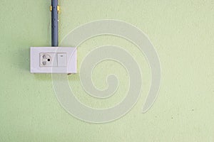 Electricity Switches and Socket on cement wall background