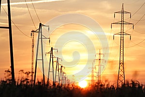 Electricity towers at sunset