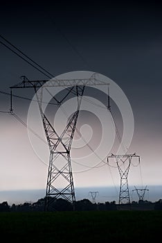 Electricity transmission power lines at sunset High voltage tower