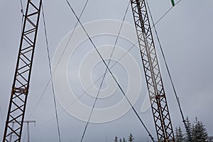 Electricity transmission power lines on winter background High voltage tower.